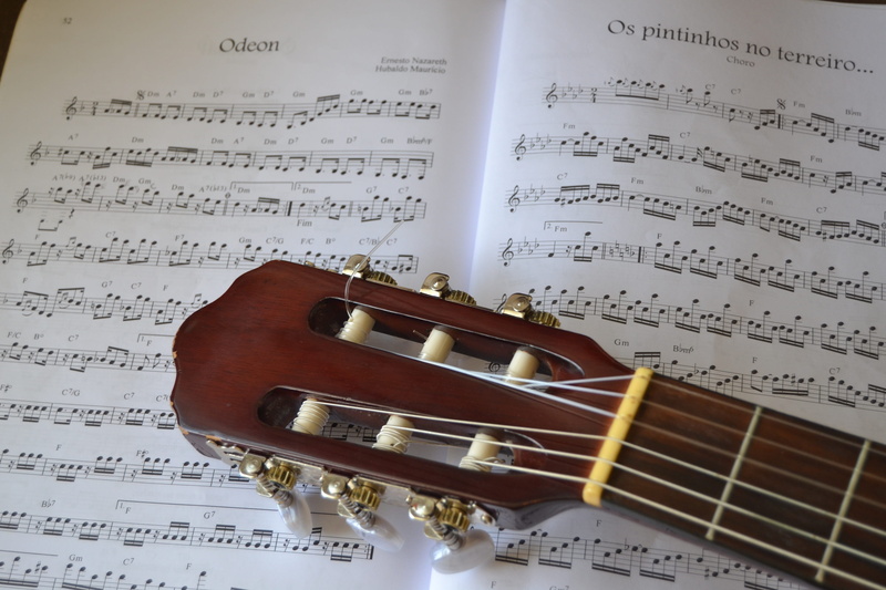 brown, guitar over music sheet, nylon, brazilian music, arts culture and entertainment, choro, music harmony, note, guitar, chorinho, key, musical instrument