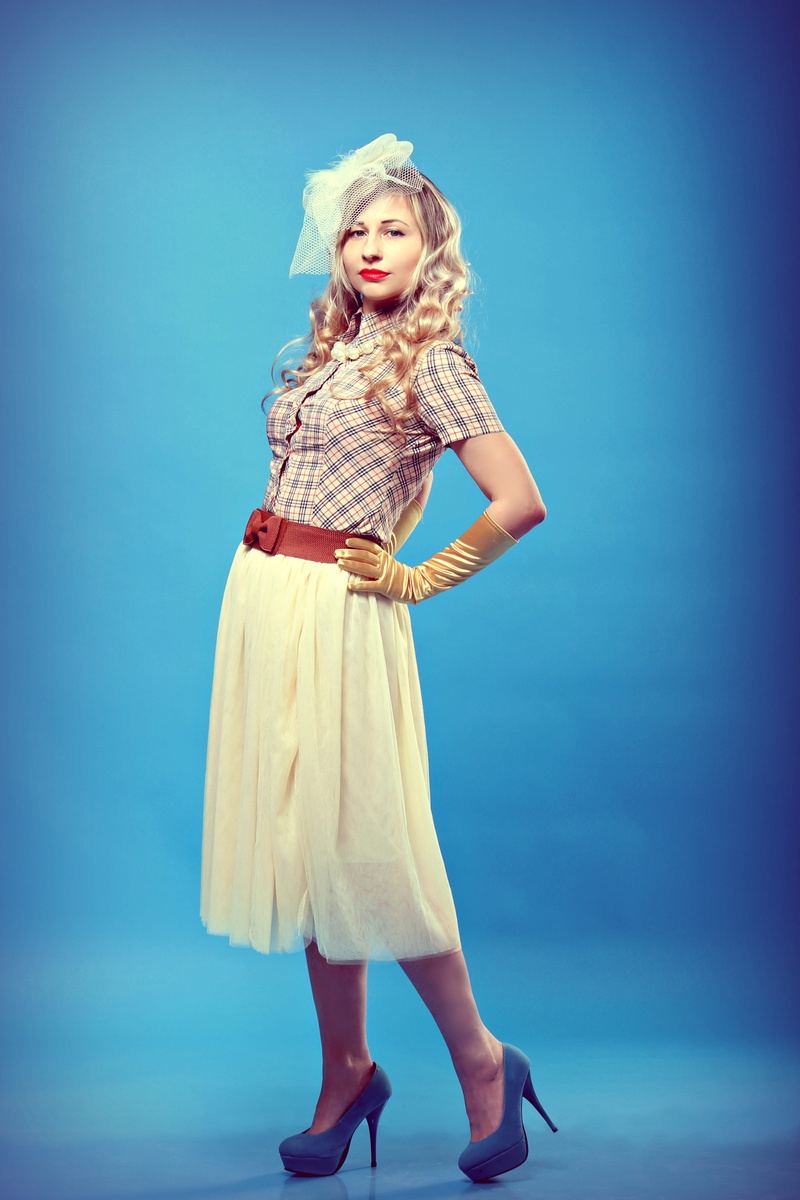 young women, beautiful woman, golden color, fashion, hat with veil, grace, skirt, portrait, blue, young, in the studio, skirt tutu, looking at camera, satin gloves
