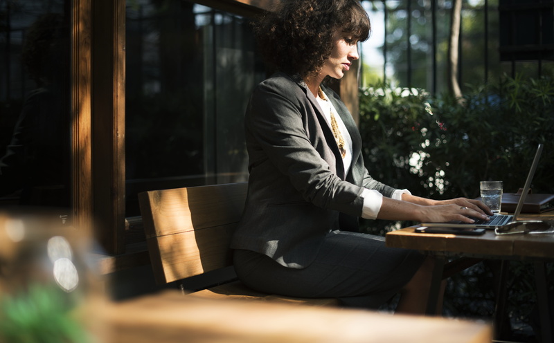 laptop, one person, glass, internet, hairstyle, hair, break, business, business person, bench, cafe, coffee shop, connection, adult, curly hair, working