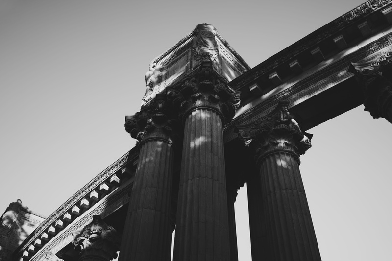 sky, architecture, archaeology, low angle view, grayscale, belief, tourism, photo, black and white, clear sky, colonnade, pedestals, steeple