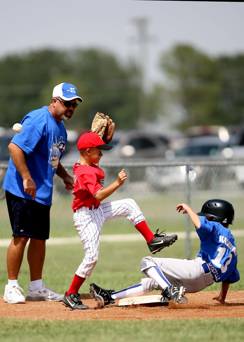uniform, helmet, youth, men, real people, athletic, child, dirt, childhood, game, leisure activity, ball, fence, glove, slide, base, little league, outdoors