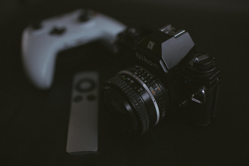 lens cap, single object, equipment, apple tv, no people, finger, home video camera, xbox, adapter, strap, collage, video camera, still life, flower, cassette player