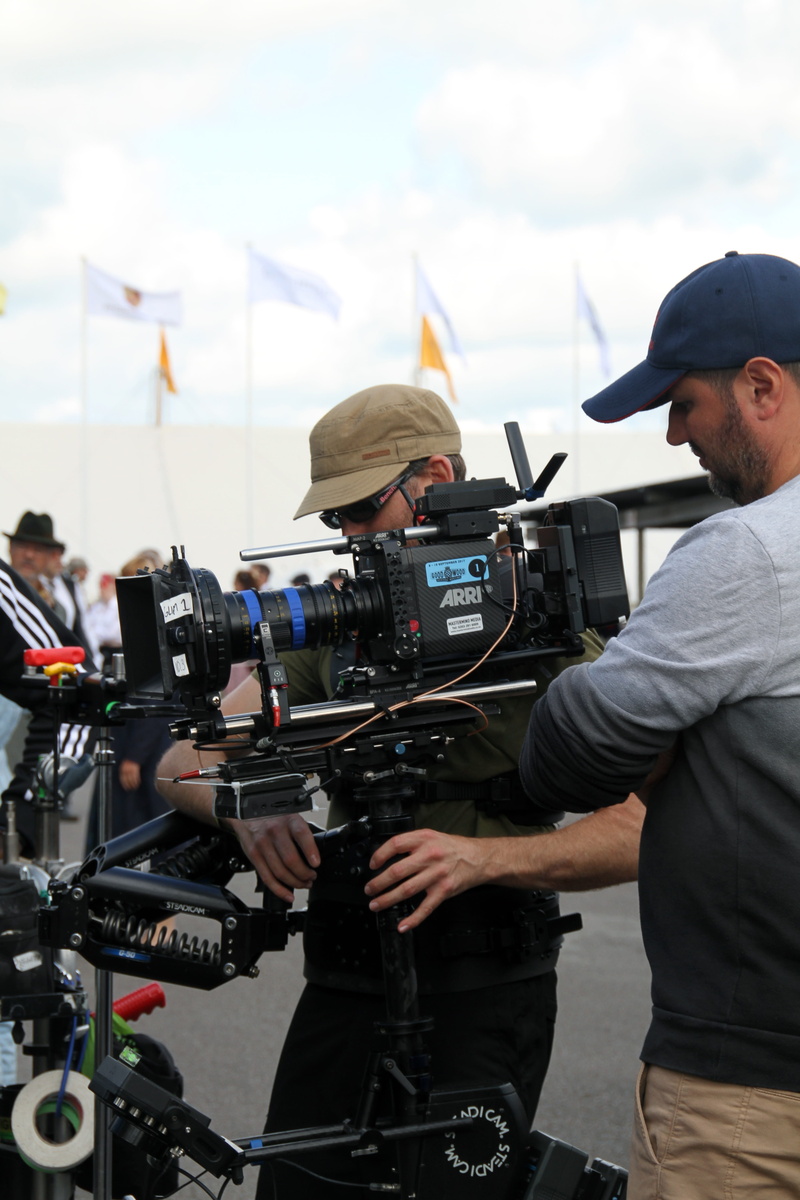 three quarter length, people, males, television camera, camera man, arts culture and entertainment, sky, tv, occupation, real people, focus on foreground