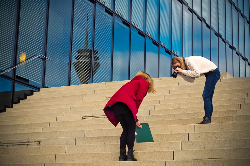 men, warm clothing, full length, staircase, adult, building, people, steps and staircases, recording, women, out, photo, skyscraper, photo shoot, business