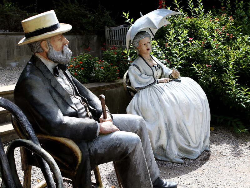 two people, plant, Grounds For Sculpture, lifestyles, transportation, sculpture, senior men, sitting, real people, painting french, clothing, cowboy, people