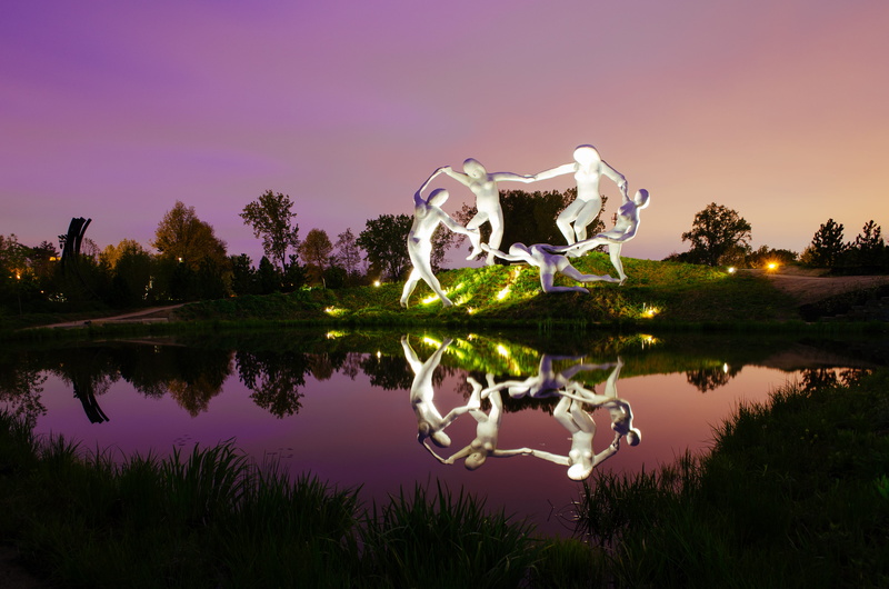 plant, purple, tranquil scene, art, tree, pond, nature, light, water, dusk, outdoors, symmetry, reflection lake, sky, sculpture, night, illuminated, sunset