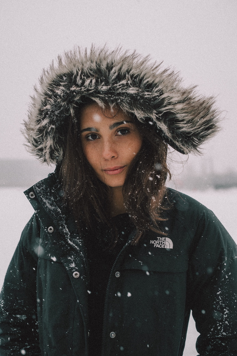 hair, cold temperature, beautiful woman, one person, black, 5K, north, lifestyles, real people, hood - clothing, faux, front view, snowing, clothing, young women