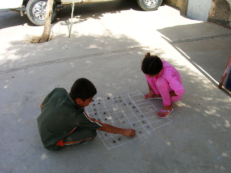high angle view, togetherness, casual clothing, child, Road, innocence, Play, full length, flashlights, play outside, chalk, playing, boys, iraq, Children