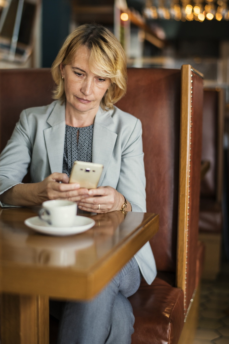 suit, manager, messaging, leisure activity, remotely, chair, smartphone, communication, checking, connection, cafe, professional, woman, businesswoman