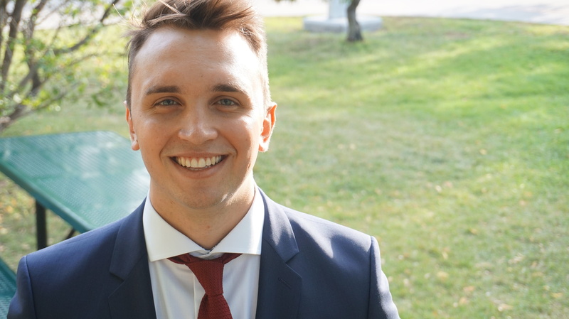 bright, learning, smiling, adult, business, university of regina, school, one person, up, student, confidence, happy, happiness, front view, suit, emotion