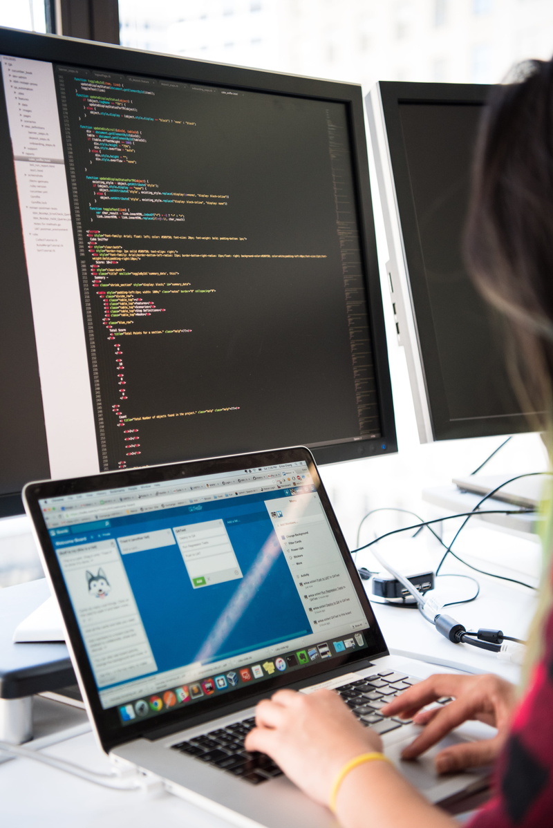 programmer, display, desk, computer monitor, technology, person, coding, screen, adult, computer equipment, electronics, human hand, internet, using laptop