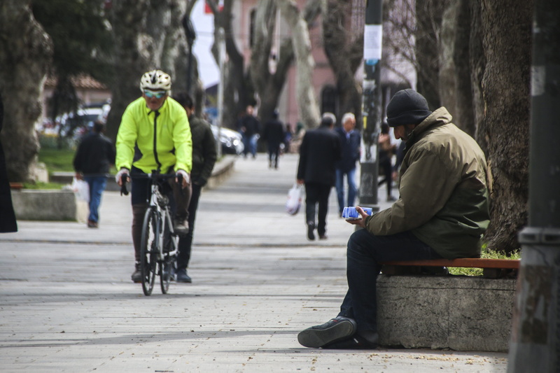people, hood - clothing, architecture, transportation, men, mode of transportation, eyüp sultan, lifestyles, avenue, real people, warm clothing, full length