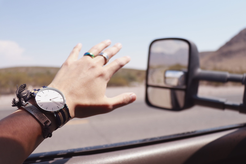 finger, window, person, real people, hand, human body part, wristwatch, men, clock, vehicle, time, human finger, human hand, land vehicle, s, daytime, transportation
