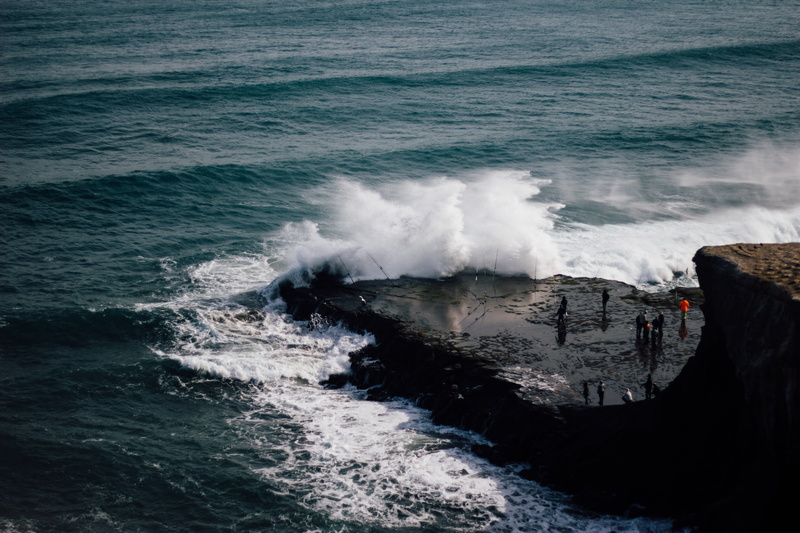 pavement, waves, ocean, no people, standing, coast, aquatic sport, splashing, splash, rock - object, surfing, daytime, sea, hitting, group, water, people