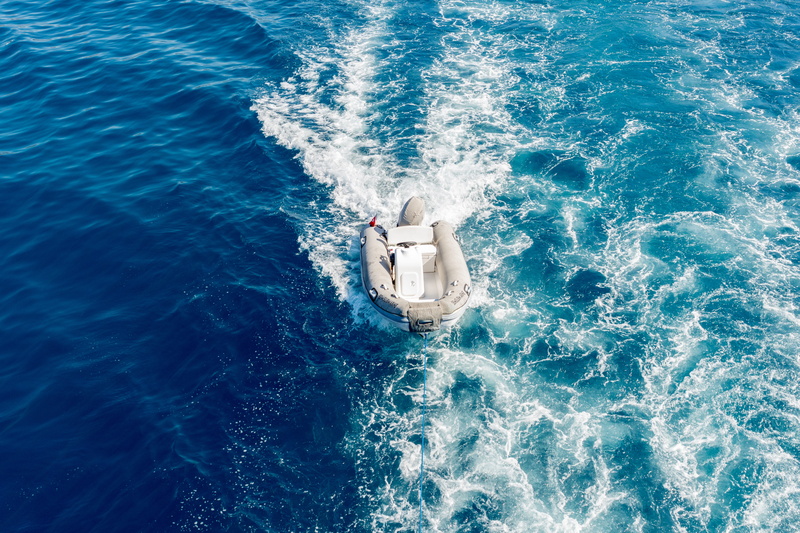 inflatable, power, transportation, white, nautical vessel, wake - water, wave pattern, blue, travel, sport, boat, water, daytime, outdoors, gray, motion
