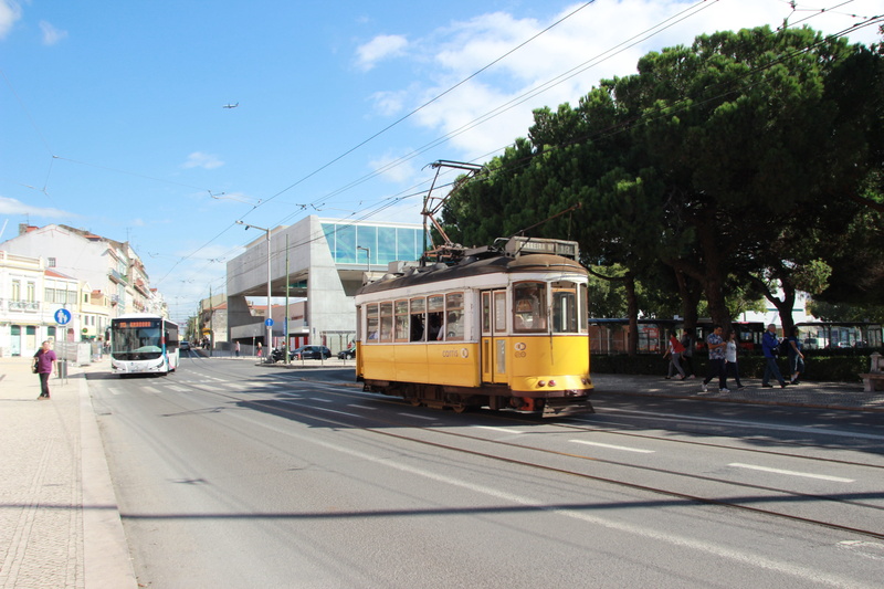 motor vehicle, lisbon, land vehicle, portugal, outdoors, architecture, built structure, public transportation, city street, sky, track, railroad track