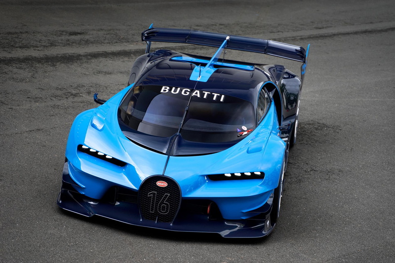 text, sign, toy, day, show, car, outdoors, white color, no people, bugatti, gran, stationary, turismo, road, blue, western script, street, high angle view