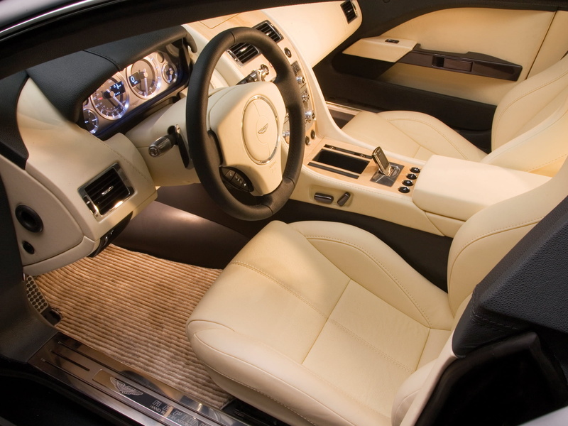 indoors, concept car, car interior, high angle view, luxury, travel, beige, motor vehicle, aston martin, vehicle Seat, mode of transportation, interior
