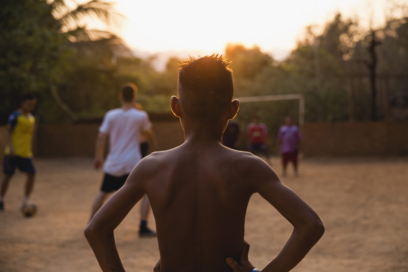 people, sunset, watching, land, goal, group, teenager, soccer, real people, golden hour, lifestyles, shirtless, dirt, leisure activity, thailand, group of people