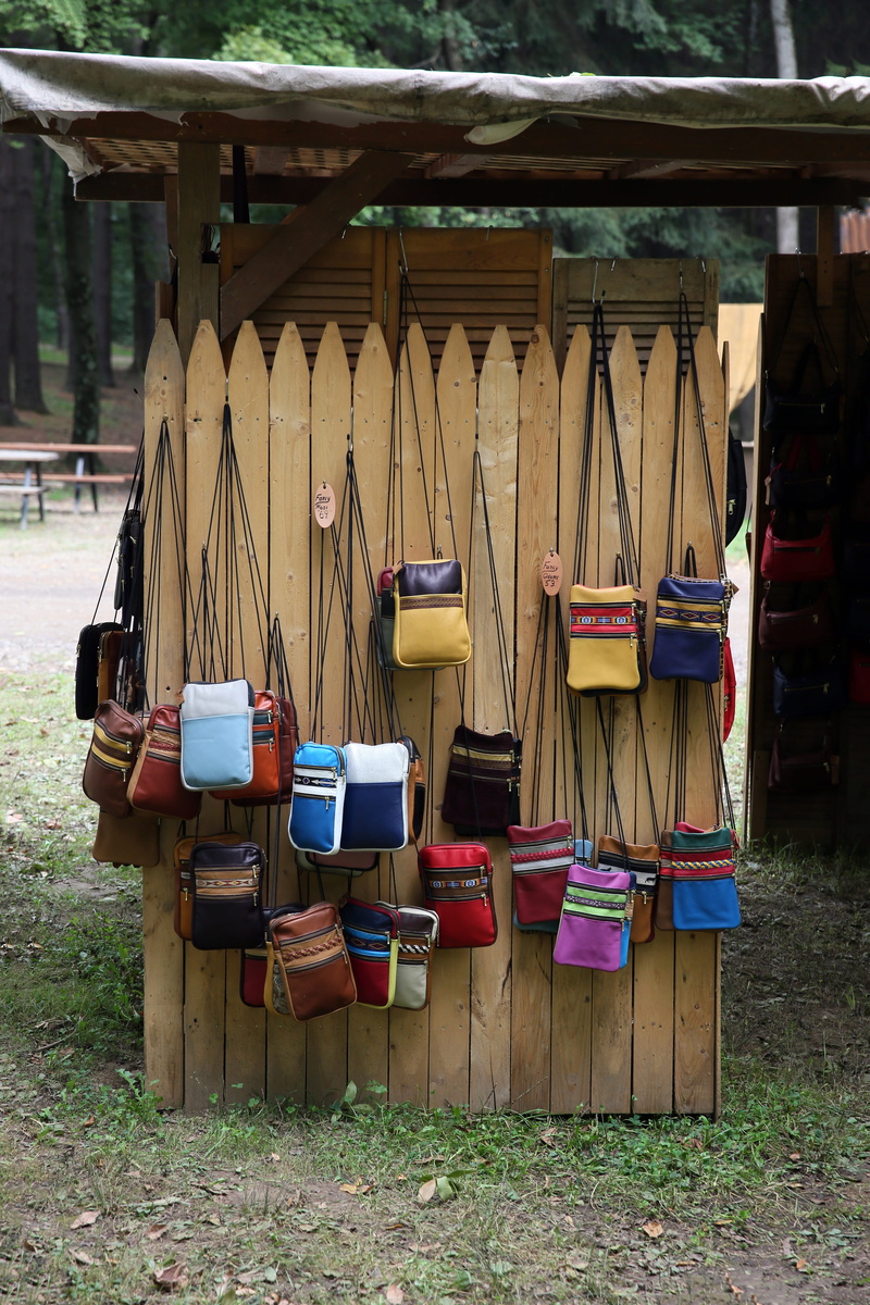 absence, built structure, seat, field, large group of objects, tote bag, building, outdoors, no people, accessories, accessory, building exterior, wood