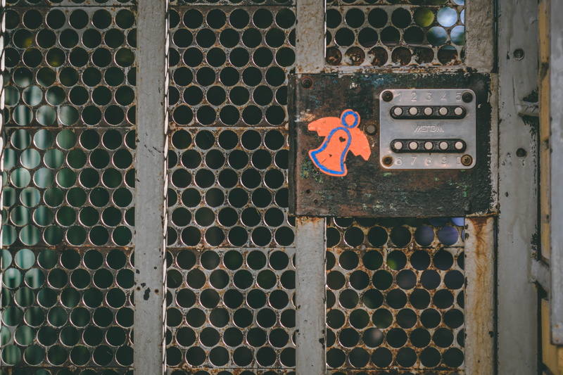 slate, fence, window, rug, no people, symbol, banister, safety, day, gate, pattern, entrance, metal, crypt, dome, grey, building, arcade game machine, communication