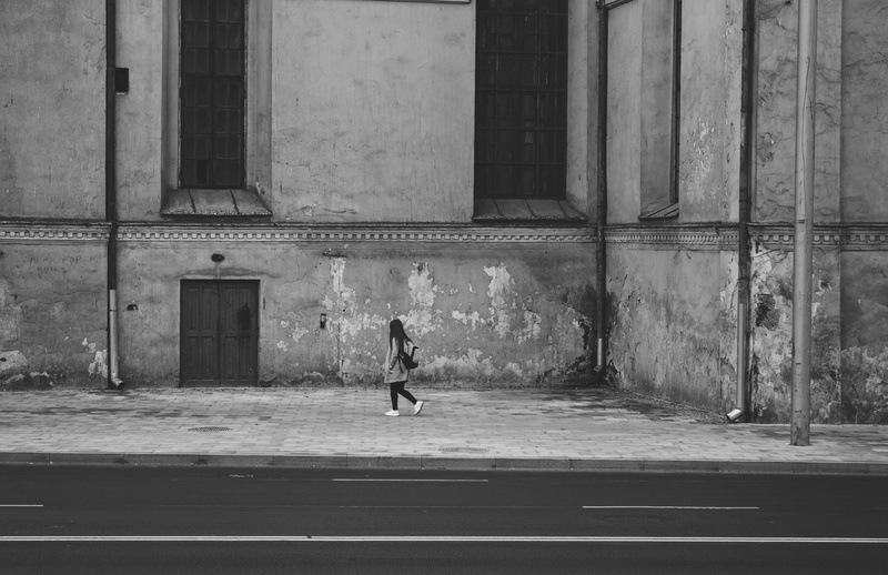 shadow, abandoned, pavement, black-and-white, high, alone, door, leisure activity, woman, entrance, adult, scale, standing, wall - building feature, wear