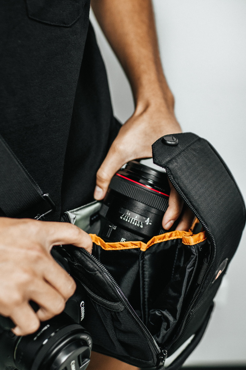 wheel, zipper, one person, real people, figurine, standing, cylinder, safety, briefcase, bag, adult, occupation, human body part, digital camera, muscular build