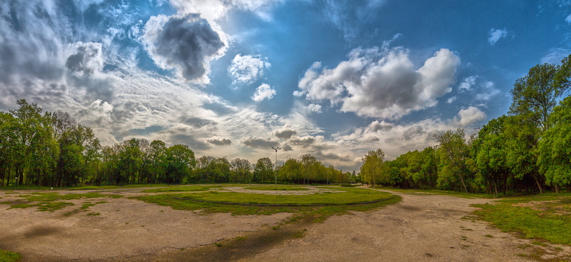tree, blue sky, tranquil scene, 10 euros, outdoors, landscape, travel, green color, trees, no people, daylight, nature, beauty in nature, blue, grass, green - golf course