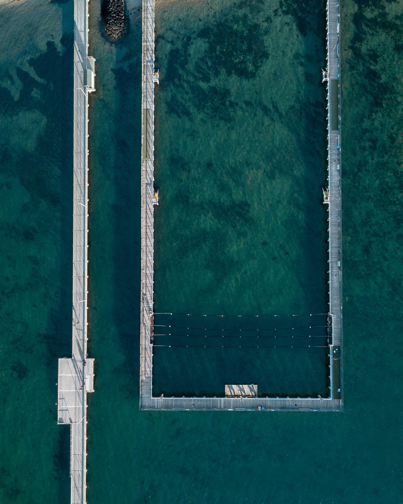water, turquoise colored, outdoors, day, 2K, sea, pool, high angle view, aerial, construction, architecture, reflection, swimming pool, window, built structure