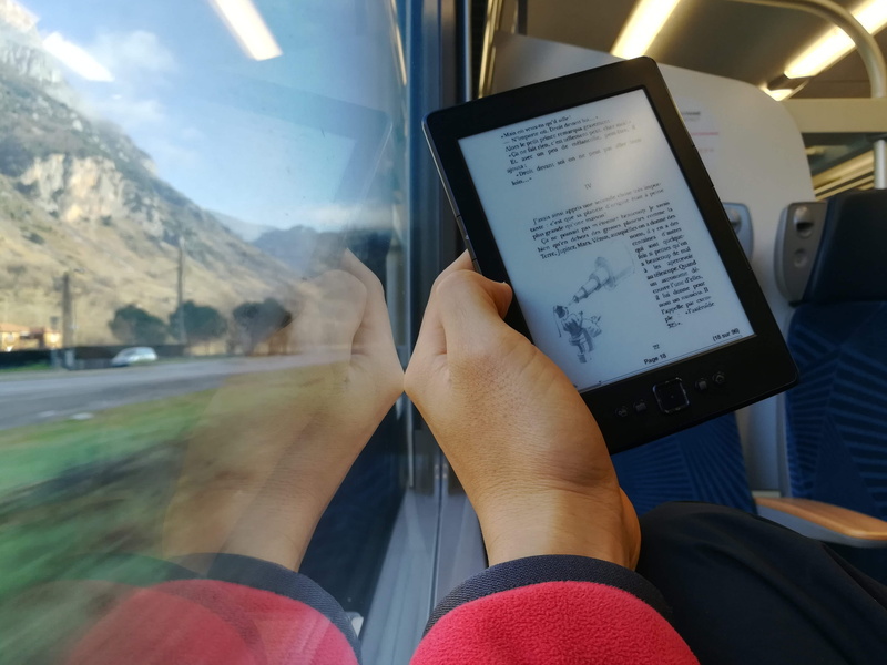 human, wireless technology, Reading, lifestyles, display, real people, Story, adult, Travel, tablet computer, phone, Adventure, Ebook, lcd screen, vehicle interior