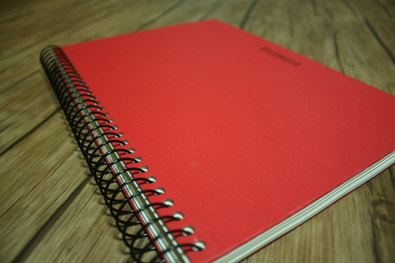 indoors, spiral, close-up, no people, paper, red, office supply, document, handbook, book, wood - material, spiral notebook, notes, 4K, copy space, still life