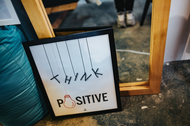 western script, picture, text, wood - material, focus on foreground, handwriting, indoors, pictures, technology, frame, table, image, wireless technology