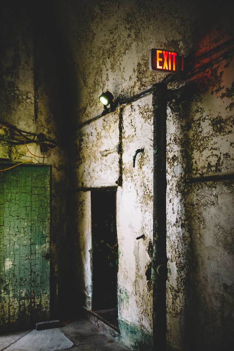 exit, lighted, wood, weathered, communication, ruined, architecture, dirty, built structure, door, exit sign, sign, entrance, day, infrastructure, building