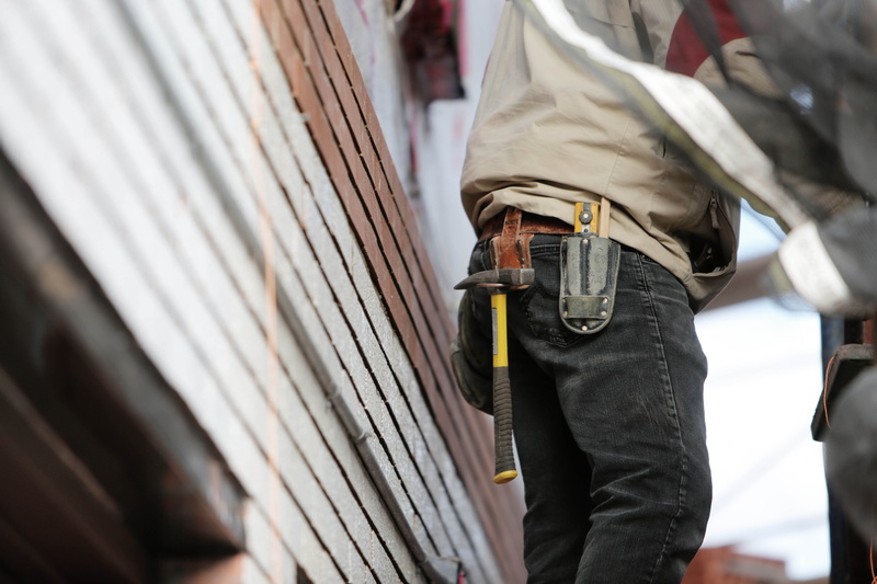 build, clothing, human body part, body part, tools, standing, construction, social issues, weapon, builder, walking, knife, work, person, man, focus on foreground