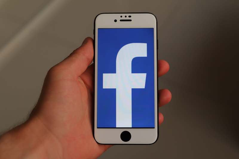 close-up, social networks, icon, display, technology, one person, blue, indoors, smart phone, iphone, social media, holding, app, social snapchat, human hand