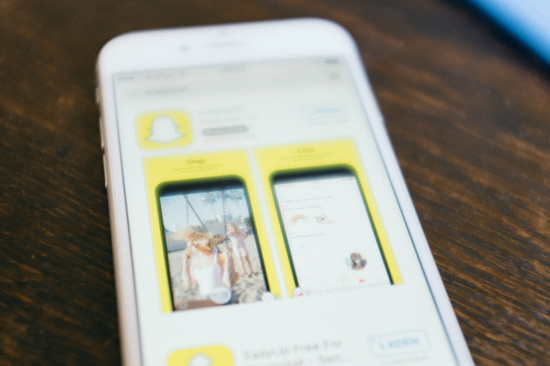 store, technology, selective focus, editorial, portable information device, choice, close-up, day, wood - material, app, focus on foreground, text, App store