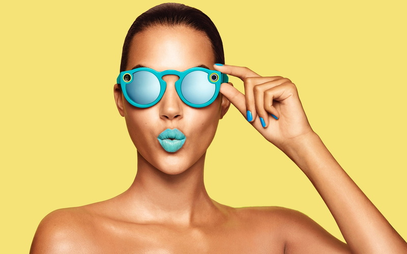 tech, body part, studio shot, yellow, one person, indoors, holding, snapchat, yellow background, mouth open, looking, front view, colored background