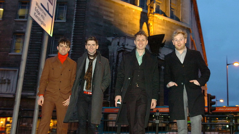 night, built structure, business, coworker, band, architecture, group of people, happiness, building exterior, street, men, outdoors, clothing, standing