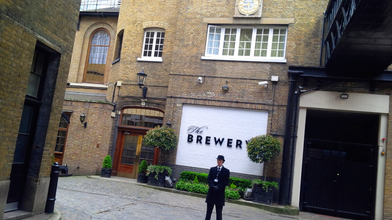 walking, real people, city, window, day, full length, rear view, bowler hat, lifestyles, women, brewery, 52 chiswell st, london, building, hotel, footpath