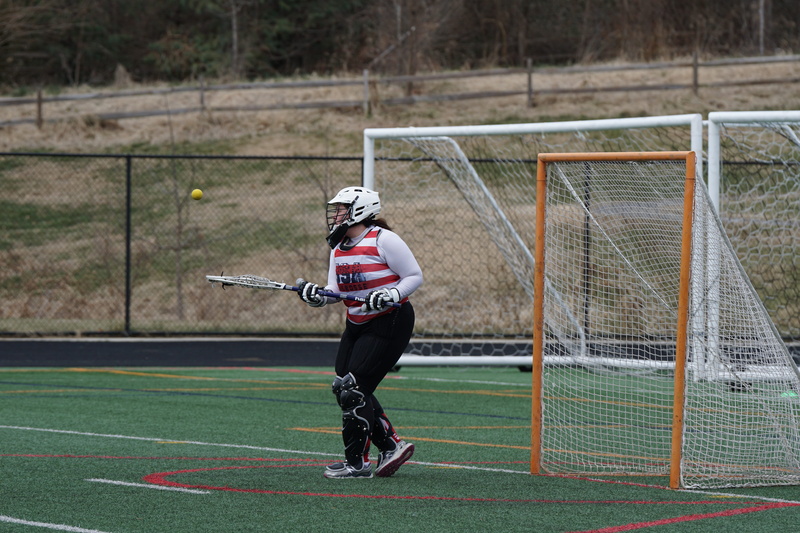 standing, one person, woman, sports equipment, football helmet, people, field, sport, motion, apparel, hockey, clothing, crash helmet, helmet, teenager