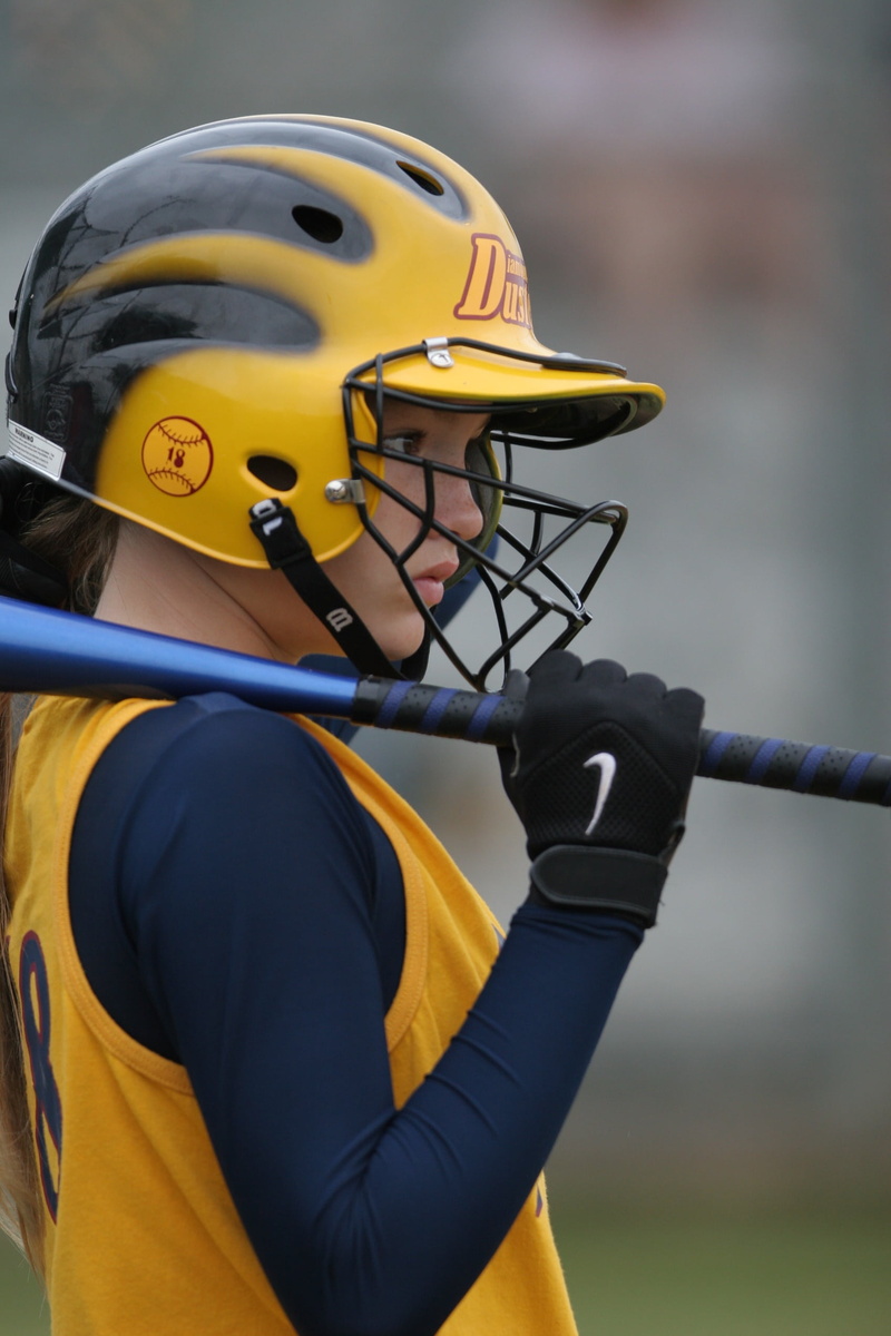 real people, headwear, men, batter, teen, safety, lifestyles, player, young, focus on foreground, close-up, game, helmet, female, uniform, clothing, sports helmet