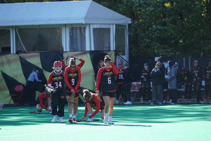 helmet, huddle, group of people, leisure activity, person, domestic, animal wildlife, skill, sports, clothing, building, men, people, hockey, horse, outdoors