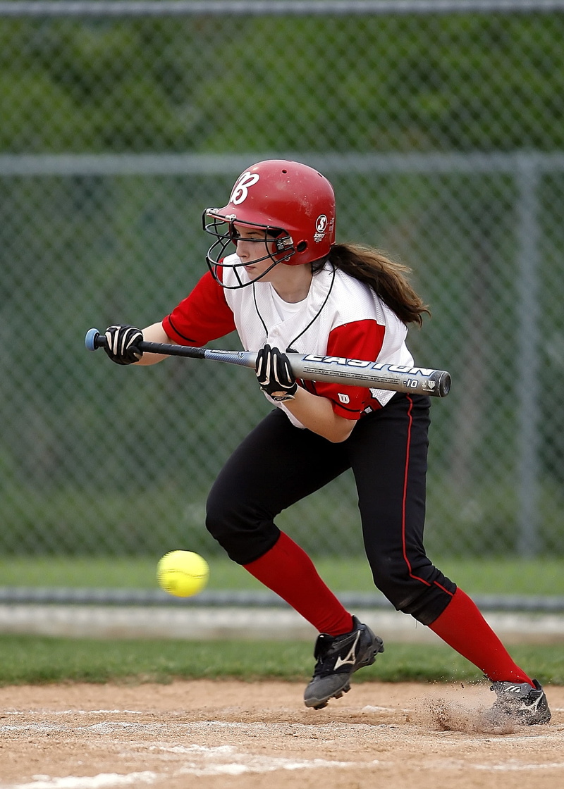 full length, softball, female, bat, runner, competition, hit, helmet, one person, batter, sports helmet, adolescence, game, childhood, clothing, teen, sports uniform