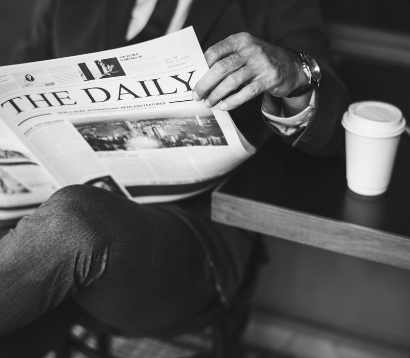 coffee shop, men, take away, person, holding, cafe, text, leisure activity, communication, food and drink, cup, sidewalk cafe, the daily, newspaper, man