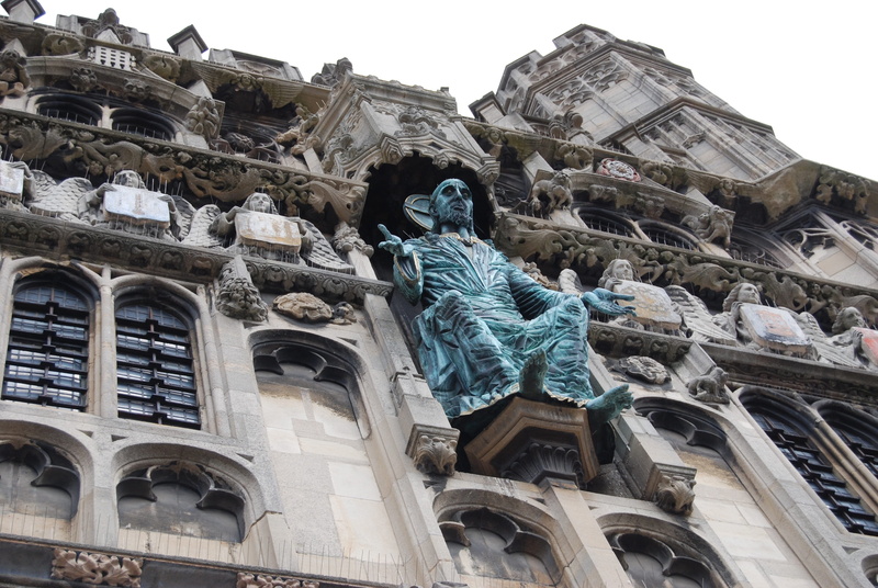 construction, low angle view, male likeness, metal, artwork, design, 4K, perspective, sculpture, building exterior, religious, belief, art, metal work
