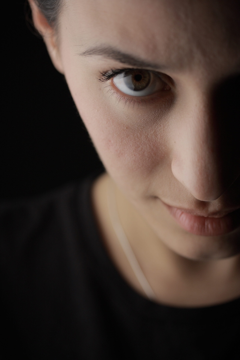 selective focus, serious, dark, caucasian Ethnicity, lip, the young woman, close-up, shirt, lifestyle, contact, face, photography, looking, eyes, body part