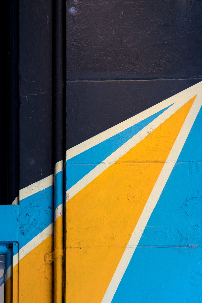 city, wall - building feature, multi colored, white color, street, mural, pattern, building exterior, painted, backgrounds, striped, creative, day, wood - material