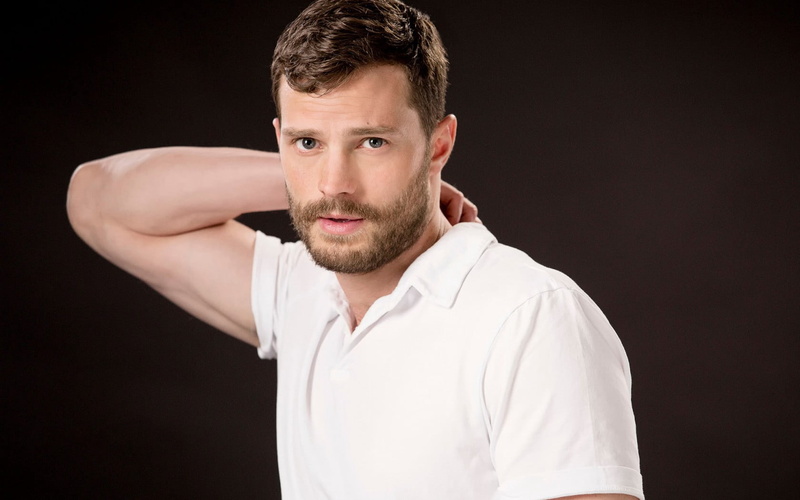 indoors, front view, white, one person, black background, polo, adult, facial hair, jamie dornan, men, face, looking at camera, 720P, photo shoot, shirt
