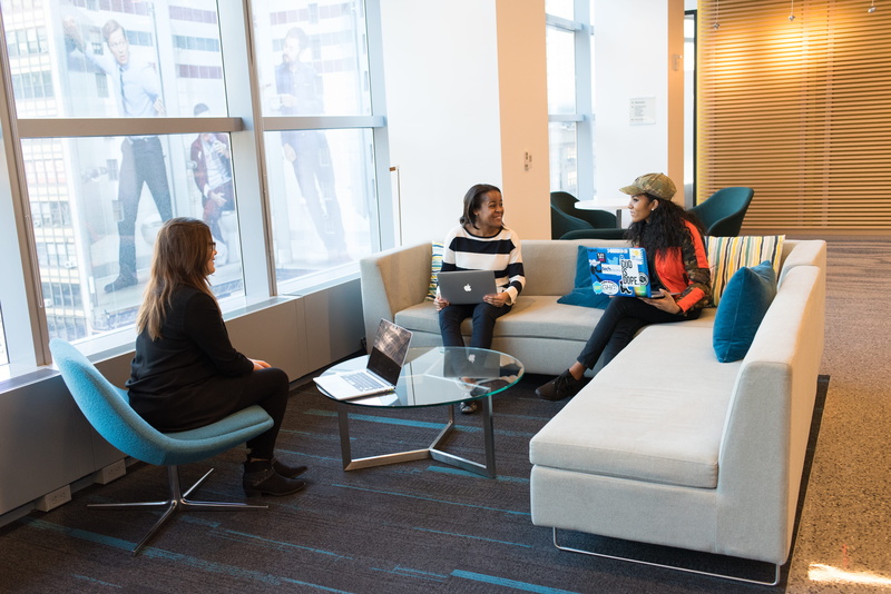 meeting, indoors, casual clothing, table, seat, laptops, sitting, people, room, desk, technology, using laptop, women, communication, workspace, office