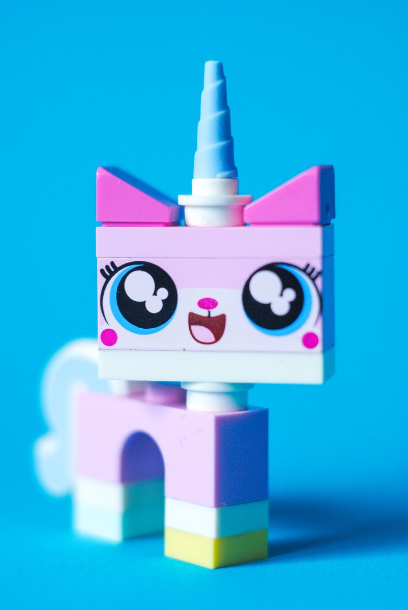 toy, unicorn, studio shot, relaxation, blue background, pink, 4K, pink color, creativity, large group of objects, lego, in a row, representation, white